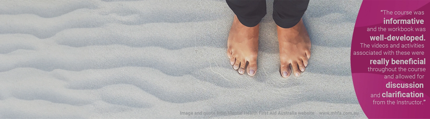 first nations student's feet in sand